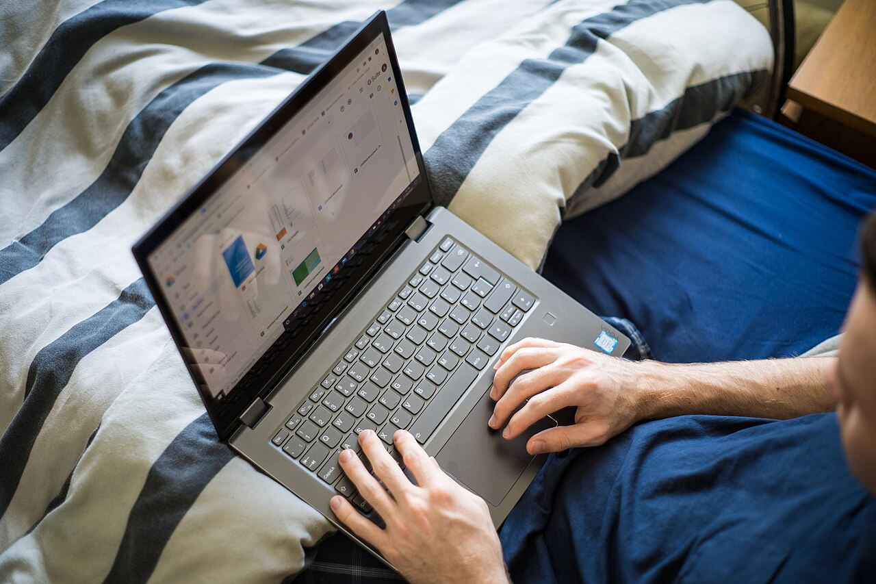 Business owner managing a website on a laptop
