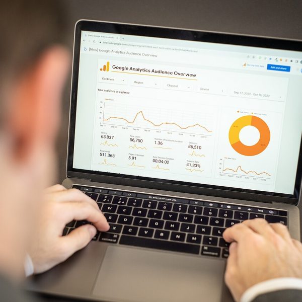 Marketer reviewing website analytics on a laptop