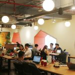 Modern coworking space with people at work