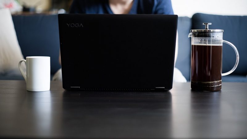 Laptop and coffee on a desk